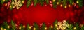 Christmas and New Year red background with realistic pine branches, candy canes, serpentine, glitter gold snowflake