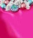 Christmas, new year`s composition of silver and blue Christmas tree toys and a white Christmas tree on a pink background. Royalty Free Stock Photo