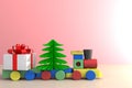 Christmas and New Year`s Day, Christmas gift and train on wood table