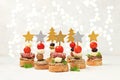 Christmas and New Year\'s dishes, a set of snacks for the festive table. Canapes of tomatoes, pate, mozzarella cheese,