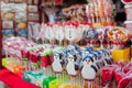 Christmas and New year`s street fair sweet food. Snowman shaped candies, lollypops and candy canes in shop