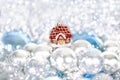 Christmas and New Year`s toy fairy tale red house in snowdrifts and snow of Christmas balls and tinsel in blue and white colors Royalty Free Stock Photo