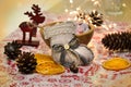 Christmas and New Year`s winter holiday Christmas stocking on the table. Composition. Garland, deer figurine, fir cones Royalty Free Stock Photo