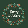 Christmas and New year`s wreath out of twigs, leaves and red berries with words Happy holidays on green background. Royalty Free Stock Photo