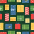 Christmas and New Year seamless pattern. Colorful gift boxes on green background. Doodle style. Royalty Free Stock Photo