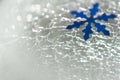 Christmas and New Year. Snowflake against the background of cracked ice