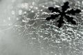 Christmas and New Year. Snowflake against the background of cracked ice