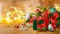 Christmas or New Year still life with gift boxes, fir branches and Christmas baubles on a wooden table. Festive concept