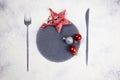 Christmas minimal table setting decoration. Cookies, stars and balls. Flour imprint of fork, plate and knife. Christmas aesthetics