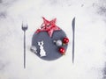 Christmas minimal table setting decoration. Cookies, stars and balls. Flour imprint of fork, plate and knife. Christmas aesthetics