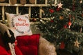 christmas and new year time. cozy soft armchair or easy chair with a comfy plaid and a red pad pillow Royalty Free Stock Photo