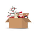 Christmas and New Year toys in cardboard box. Santa Claus, Christmas tree with red balls, Teddy bear, penguin Royalty Free Stock Photo