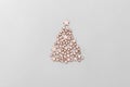 Christmas and new year tree made of wooden stars on light grey background. Minimalistic clean bright style Royalty Free Stock Photo