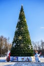 Christmas and New Year tree, Russian Santa Claus and Snowman on a frosty sunny day.