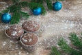 Three Christmas cakes, winter snowbound wooden background, blue