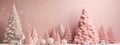 Christmas New Years banner fluffy pink Christmas trees silver ornaments on pastel background. Minimalist decoration of home