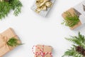 Christmas New Years frame composition with gift boxes pine cones cypress tree branches on white background. Holiday card poster Royalty Free Stock Photo