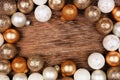 Christmas or New Years frame of gold and white decorations on a dark rustic wood background