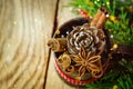 Christmas New years vintage greeting card cinnamon anise pine cones fir tree branches on rustic wood background Royalty Free Stock Photo