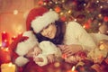 Christmas Newborn Baby and Mother, New Born Kid Sleep with Mom Royalty Free Stock Photo