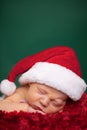 Christmas Newborn Baby Wearing Santa Hat and Sleeping Royalty Free Stock Photo