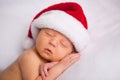 Christmas Newborn Baby Wearing Santa Hat and Sleeping Royalty Free Stock Photo