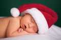 Christmas Newborn Baby Wearing Santa Hat and Sleeping Royalty Free Stock Photo