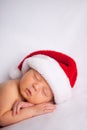 Christmas Newborn Baby Wearing Santa Hat and Sleeping Royalty Free Stock Photo