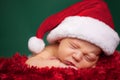 Christmas Newborn Baby Wearing Santa Hat and Sleeping Royalty Free Stock Photo