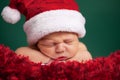 Christmas Newborn Baby Wearing Santa Hat and Sleeping Royalty Free Stock Photo