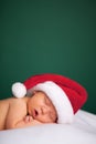 Christmas Newborn Baby Wearing Santa Hat and Sleeping Royalty Free Stock Photo