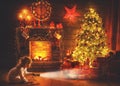 Christmas night. baby girl with a flashlight at night looking for gifts under Christmas tree Royalty Free Stock Photo