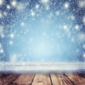 Christmas night background. A snowstorm and an empty table in th Royalty Free Stock Photo