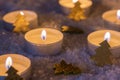 Christmas night with candle lights and golden decoration on snow