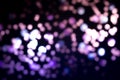 Christmas colorful light black overlay background. Defocused blue, violet and pink bokeh. Holiday garland lights Royalty Free Stock Photo