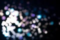 Christmas colorful light black overlay background. Defocused blue, violet and pink bokeh. Holiday garland lights Royalty Free Stock Photo