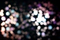 Christmas colorful light black overlay background. Defocused blue, violet and pink bokeh. Holiday garland lights Royalty Free Stock Photo