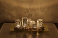 Christmas night composition on coffee table. Burning candles, golden glass candlesticks