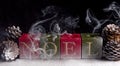 Christmas Noel candles with smoke Royalty Free Stock Photo