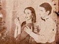 Christmas nostalgy couple on Christmas party 1910-1940. Royalty Free Stock Photo