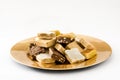 Christmas nougat on a golden plate isolated