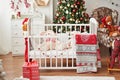 Christmas nursery, Christmas decor in children`s bedroom, children`s playroom decorated for new year, white children`s bedroom, Ch Royalty Free Stock Photo