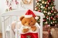 Christmas nursery, Christmas decor in children`s bedroom, children`s playroom decorated for new year, white children`s bedroom, Ch Royalty Free Stock Photo