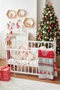 Christmas nursery, Christmas decor in children`s bedroom, children`s playroom decorated for new year, white children`s bedroom, Ch Royalty Free Stock Photo