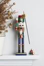 Christmas nutcracker solider broken with dead pine tree Royalty Free Stock Photo