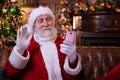 Christmas online congratulations from Santa. Santa Claus using mobile phone for distance Christmas call people and kids