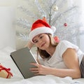 Christmas online congratulations. Smiling woman in santa hat