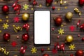 Christmas online shopping from home phone with blank white display top view. smart mobile with copy space on colored