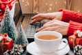 Christmas online shopping, work and education. New Year decorations on table. Woman with notebook computer at home. Winter Royalty Free Stock Photo