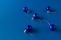 Christmas ornament balls on blue background. Blue aesthetic. Minimal holiday idea. Copy space